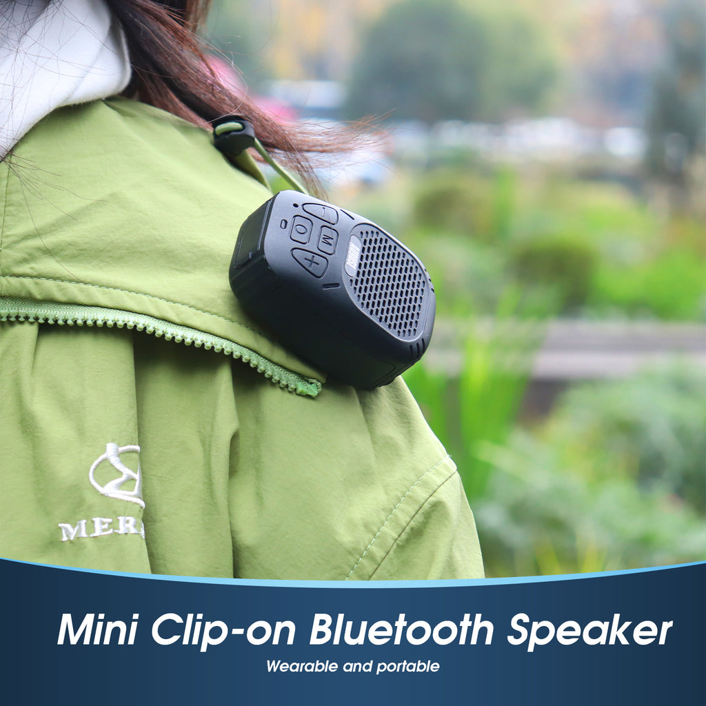 The August MS550 Mini Bluetooth Speaker Clipped onto a persons coat colar.